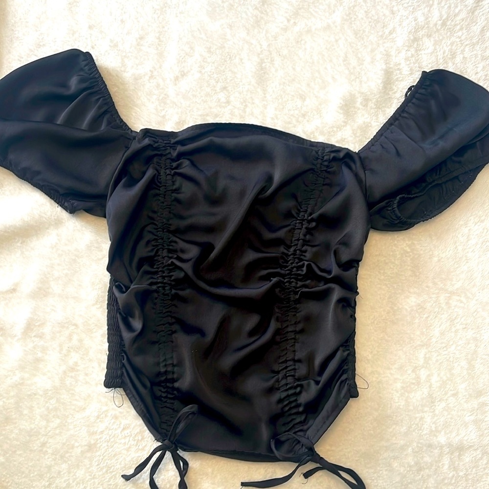 Forever 21 black silky top, front laces adjustable. Off the shoulder optional